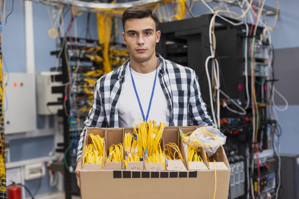 handsome-man-holding-box-with-different-optical-fiber
